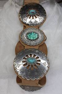lot 206 image: Signed Leatherock USA suede leather metal concho belt adorned with tumbled Turquoise and ceramic accents. Adjustable from 32-37L with snap closures. Marked on back.