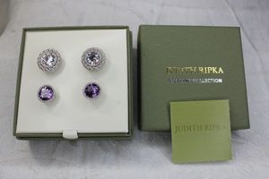 lot 209 image: Signed Judith Ripka Sterling Silver Collection post earrings (Amethyst and CZ) in box with booklet and original jackets. Both earrings are marked 925 Judith Ripka on back