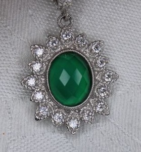 lot 211 image: Signed Judith Ripka faceted faux Emerald and CZ dangle pendant. Marked 925 CZ Judith Ripka on CZ decorated bale with safety catch. 1.5L