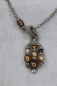 lot 212 image: Signed Judith Ripka Sterling Silver multi color freshwater pearl necklace with matching enhancer pendant. Pendant marked Judith Ripka 925 CZ. Necklace marked 925 on decorated heart clasp.