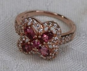 lot 216 image: Sterling Silver rose gold vermeil flower ring with Amethyst and White Topaz petals. Marked 925. Size 8