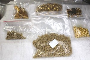 lot 223 image: Assorted jewelry findings and fittings, spacers, beads in gold finish.