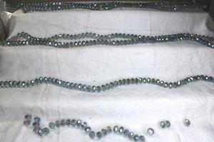 lot 233 image: (6) Strands Rainbow faceted glass AB beads.