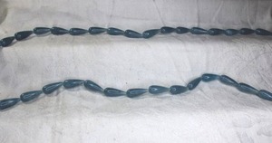 lot 234 image: Dyed Blue Jadeite cone shaped beads. (2 strands). Jadeite tested.