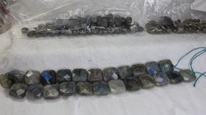 lot 235 image: Assorted size Gray Labradorite or Opal beads Includes 2 sizes of faceted donut rounds and large square beads with flash.