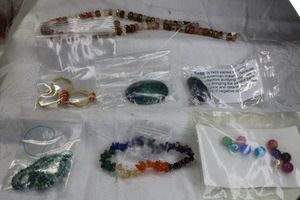 lot 238 image: Assorted gemstone jewelry & beads. Includes faceted donut Agate, Azure Malachite cabochon, multi-gemstone stretch bracelet plus. Also includes 3 fashion rings.