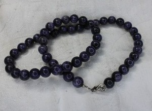 lot 254 image: Sterling Silver purple Charoite bead necklace. Marked AM 925 on lobster clasp. 16L