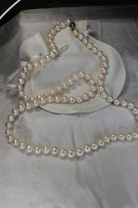 lot 256 image: Sterling Silver and large cultured 9MM Pearl necklace. Marked 925 on hidden box clasp tongue. Individually knotted. With storage pouch. 32L