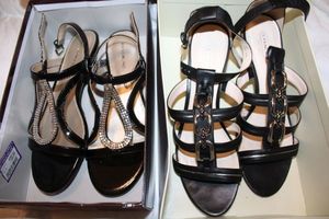 lot 125 image: Womens shoes, one looks never worn, the other gently used.  Coach black sandals size 9.5B. Bandolino Black patent sandals with silver accents size 9.5M.