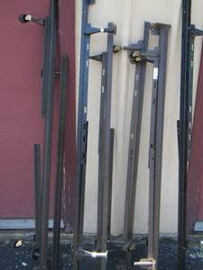 lot 79 image: large lot of metal queen bed frames
