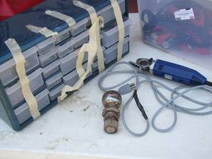 lot 83 image: Ratchet straps- 1 ball- screw caddy- dremel saw