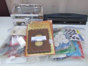 lot 105 image: office lot- whole punch, new and used small locks, 2 western wall outlets, wallpicture hooks plus