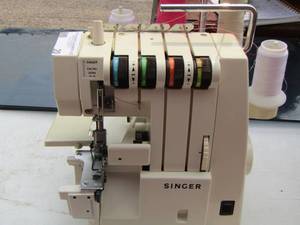 lot 20 image: SINGER Ultra lock 14u34 sewing machine