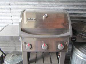 lot 147 image: WEBER propane grill used needs cleaned- HAS A FEW HAIL DENTS