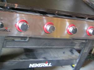 lot 12 image: NexGrill flat top GRIDLE l propane, top has small hail damage