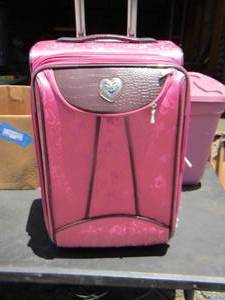 lot 156 image: pink luggage suitcase on wheels