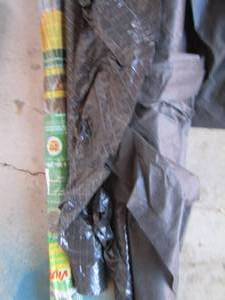 lot 179 image: new and used rolls of weed block for flower beds