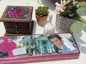 lot 68 image: Russell Stovers tin - 2 wax plants - coasters - bell