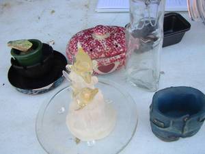 lot 191 image: covered anchor casserole 2 qt 9 dish, 2 mini bread pans, milk chocolate almond jar, plastic dolphin home dcor and more