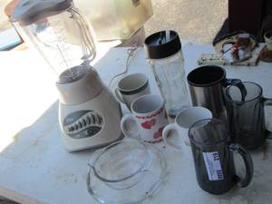 lot 219 image: coffee cups, Oster blender, Oster cup with lid and straw, handled glasses