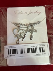 lot 50 image: Three pieces if christian necklaces