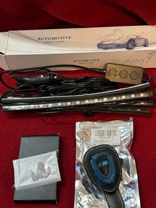 lot 130 image: Car accessories a lot wheel stickers, sunglass clip, and automotive ambient light