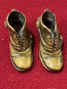 lot 176 image: 2 left foot brass boots small