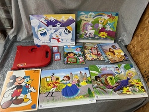 lot 228 image: Disney Childrens slot of puzzles and a story reader with some books not all books come with a cartridge