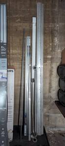 lot 23 image: Mixed Lot of Building Supplies Including Door Jam Weatherstrip, Grab Bar Safety Railing, Transition Strip, Etc.