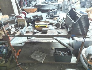 lot 285 image: Table Contents - Including Grinder, Nuts and Bolts, Vintage Door Knobs, Tools, Copper Piping, and MORE...