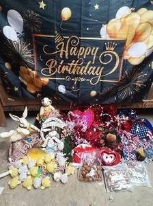 lot 276 image: Mixed Decorative Lot Including a Birthday Banner, Valentines Decor, 4th of JulyNew Years Decorations, and Easter Decor with Large Ceramic Rabbits