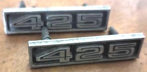 lot 406 image: 1956-1957 Chevrolet 210150 Script, 1970s Circa Fiat 1900, 1957 Plymouth Belvedere Grill Emblem
