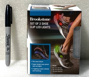 lot 207 image: New Brookstone Set Of 2 Shoe Clip LED Lights, Securely Hooks Onto Your Shoes, GreenRed Each Box - As Shown