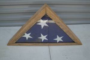 lot 35 image: Folded Military Flag in Glass and Wooden Case