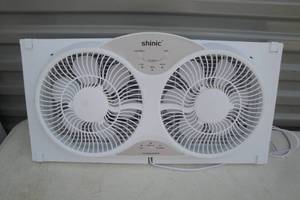 lot 121 image: Shinic-9in. Reversible Twin Fan, Window or Free Standing with Remote (Works) About 23in.x 12in. Not Including Extenders