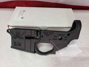 lot 67 image: NEW Spikes Tactical STLS016 Stripped AR15 Lower Receiver w Calico Jack Logo