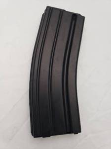 lot 285 image: DSG Black Teflon 5.56 mm 30rd Magazine w MAGPUL Anti tilt Follower