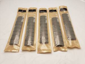 lot 394 image: MAGPUL XT Rail Panel   Dark Earth - QUANTITY 5 - BID IS TIMES THE QUANTITY