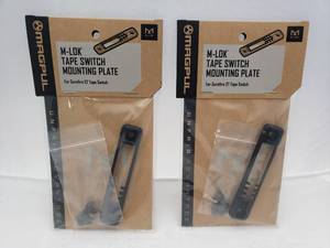 lot 1179 image: MAGPUL M LOK Surefire ST Tape Switch Mounting Plate   Black - QUANTITY 2 - BID IS TIMES THE QUANTITY