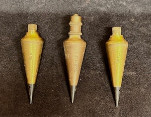 lot 45 image: LUTZ 6 oz. Brass Plumb Bob w Steel Tip &amp Screw Top W Two Without Screw Tops