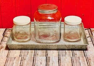 lot 91 image: Three Vintage Glass Storage Containers &amp Lids W Corrigated Steel Tray