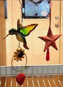 lot 100 image: Hanging Metal Hummingbird &amp Leather Texas Star