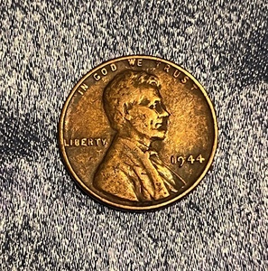 lot 141 image: 1944 Wheat Penny W No Mint Mark Error &amp Rim Rolled L