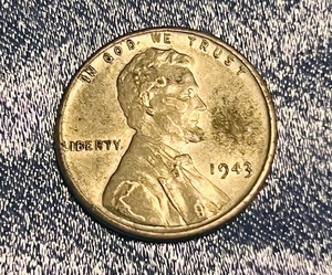 lot 142 image: 1943 Steel Penny WNo Mint Mark Error, Rim Rolled L, &amp Reverse Die Break