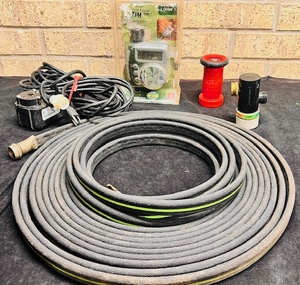 lot 240 image: Lawn Care Supplies - Including Timers, Pump, Sprayer, &amp New Soaker Hose
