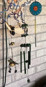 lot 285 image: Two (2) Wind Chimes - Floral &amp AntiqueVintage Faucet OnOff Wheels &amp Wind Driven Hanging Bees