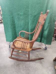 lot 165 image: Antique oak rocker - elaborate pressed decorations, caned seat, wide arms