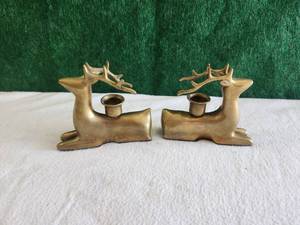 lot 30 image: Pair of brass deer-stag candlestick holders