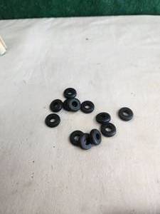 lot 167 image: Tub of rubber grommets and more