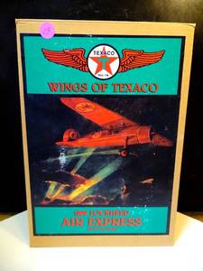 lot 13 image: NEW IN ORIGINAL BOX - Wings Of Texaco 1929 Lockheed Air Express Airplane ERTL Diecast Coin Bank